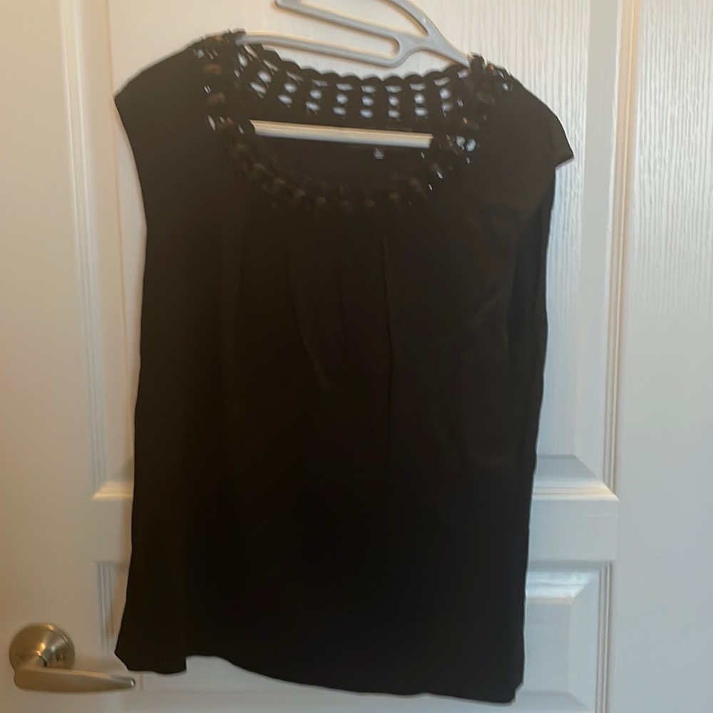 Black knit top with crochet jewel neck line